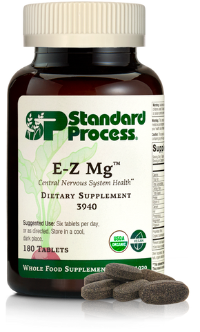 Image of E-Z Mg bottle next to tablets of magnesium supplements.