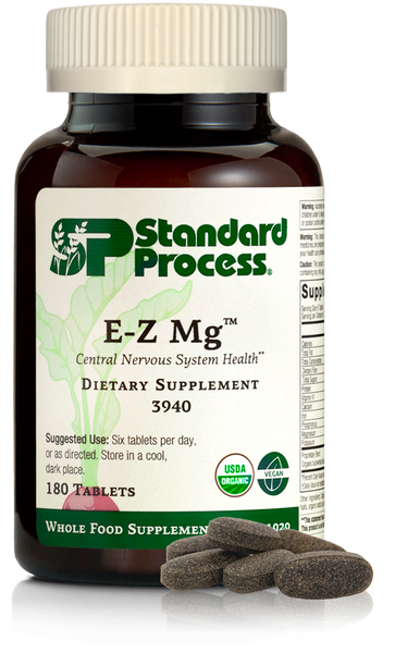 Image of E-Z Mg bottle next to tablets of magnesium supplements.