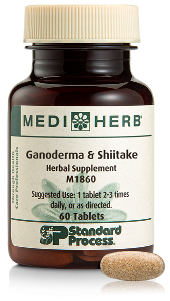 A bottle of Ganoderma & Shiitake herbal supplement next to a tablet.